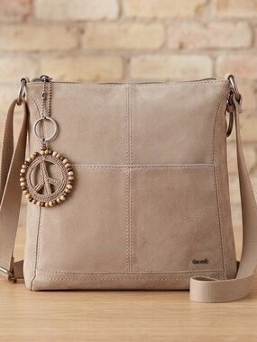 The Sak Suede Lucia Crossbody Bag in Sand Color with Crochet Peace Charm
